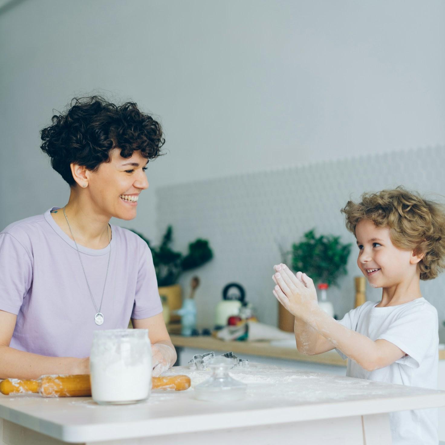 Community members collaborating in a modern kitchen space, sharing recipes and cooking techniques